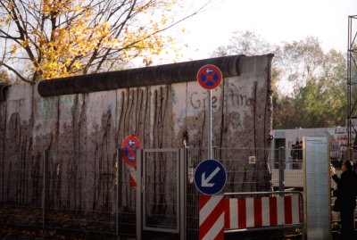 The 96 mile Berlin Wall was a concrete wall with barbed wire and an average height of 11.8 ft.