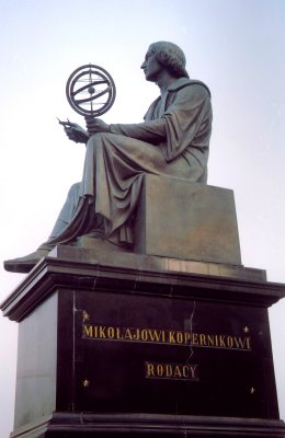 Close-up of the statue of Kopernikus (Copernicus) holding a globe.