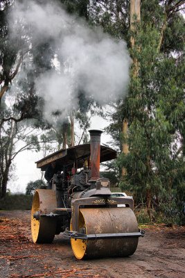 Steamroller puffing steam