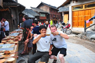 Xijiang Miao Village - drinkin God-knows-what ( but strong alcohol)  at a street party