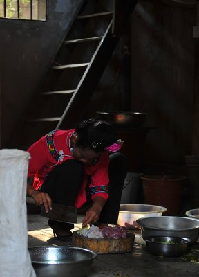 Xijiang Miao Village - Preparing dinner in high heels