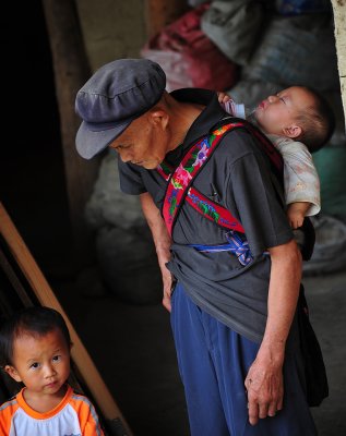 Xijiang Miao Village - Grandpa helping out