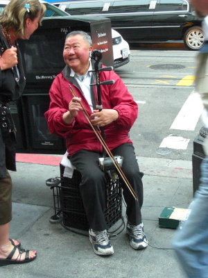He is the Erhu player seen and heard in the movie, The Pursuit of Happyness with Will Smith