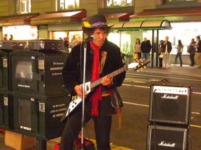He plays lots of Santana and Jimi Hendrix tunes, Geary and Powell Sts., Union Square   ISO 3200 while using a tripod