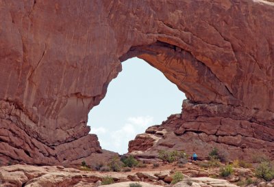 A person in blue on bottom right of arch