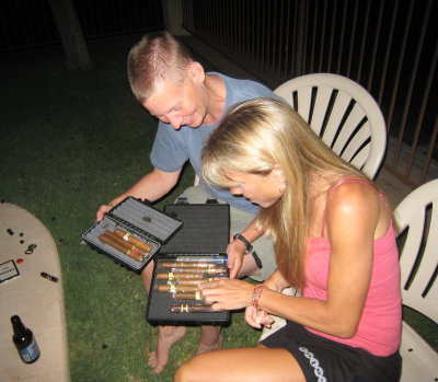 selecting a cigar at the post-post-race party by the pool.