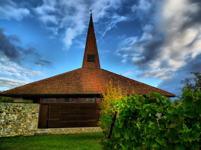 The bell tower of Givrins church is very pointed and sharp....