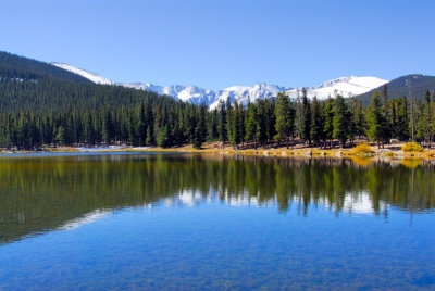 Echo Lake assumes a tranquil scene in front of the snowy Rocky Mountains