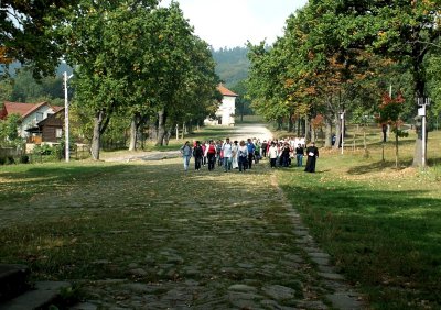 a priest with pilgrims