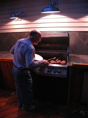 Craig grilling first steaks on new bbq