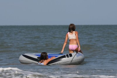 The girls go looking for a wave to ride