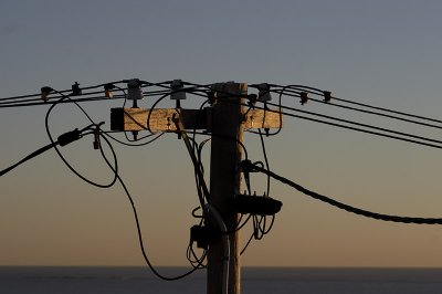 Icon. Power pole at sunset