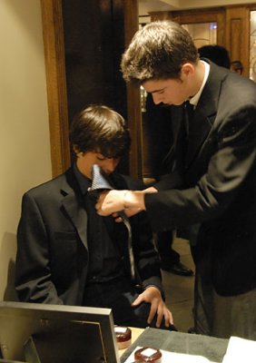 Max fixes Jack's tie