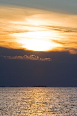 Sun over stormy clouds