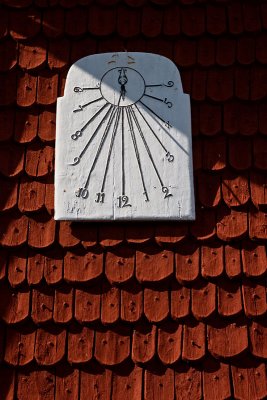 Falu red church with white sundial