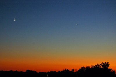Great color sunset with crescent moon