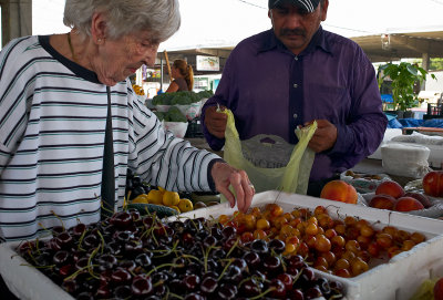 Mom picking cherries Caninios Open Produce Market 01