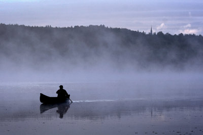 Canoe in early morning mist