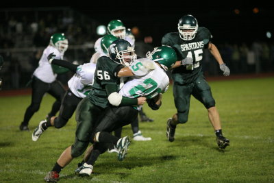 Chris Perry getting stopped by Unatego's linebacker Gage Volkes