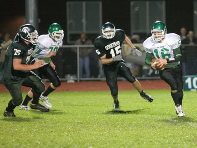 Evan Tripicco running with the ball on a quarterback keeper play which.....