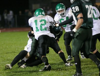 Nate Wood and Luke Daly stopping the running play