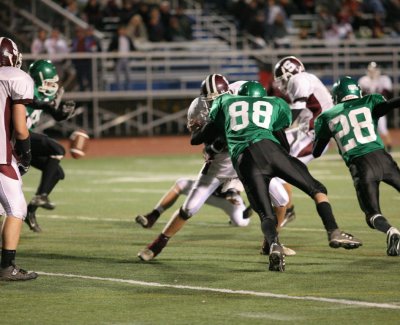 Dan Brhel and Chris Perry rushing the extra point kick after Sidney's second quarter touchdown