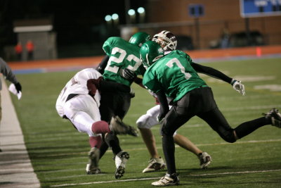 Jimmy Kvassay getting tackled by Sidney's Vince Johnson late in the fourth quarter