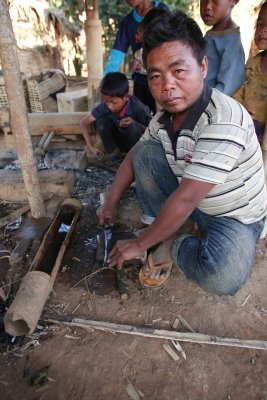 Blacksmith at work in Khmu village Ban Pahdaeng