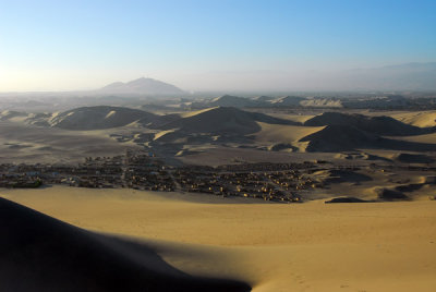 A village in the sand north of the Oasis