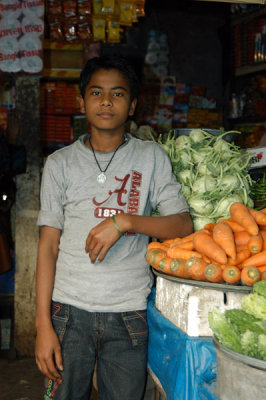 Boy working at a small shop near Motijheel AGB Colony