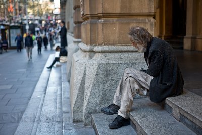 Homeless man on steps at Martin Place