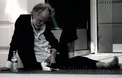Homeless man and his tin
