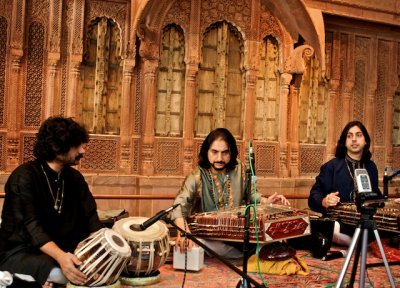 Pandit (center) playing his santoor at the Crow.jpg