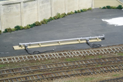 Close-up showing tank car loading pipe and hoses
