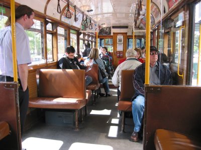 A view inside the Circle City Tram. The person standing on the left would announce each station and help answer questions