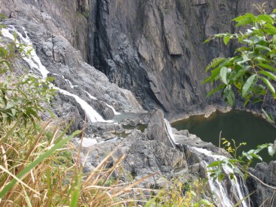 A waterfall feeding a small reservoir
