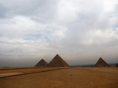 Cheops (Khufu), Chefren (Khafre), and Mycerinus (Menkaure)Cairo in the background, 14 miles away