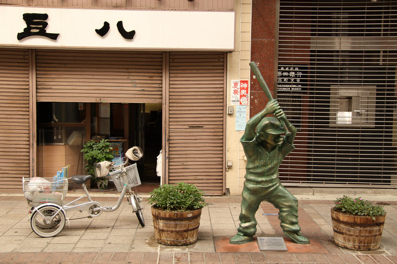 Bicycle and baseball statue in Furumachi Arcade