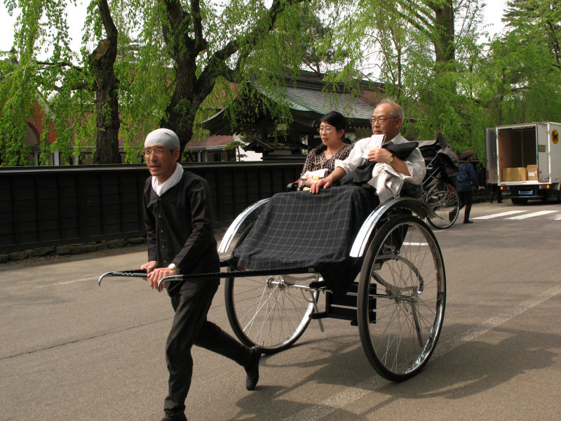 Rickshaw driver and clients in the district