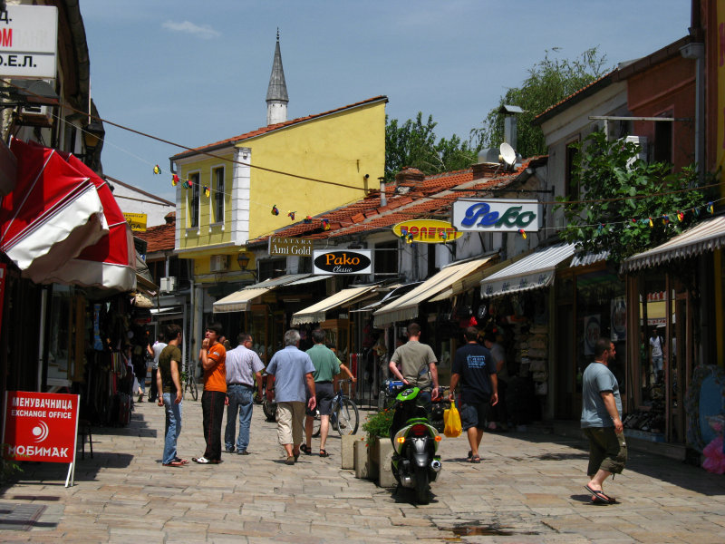 Čarija bazaar scene with minaret