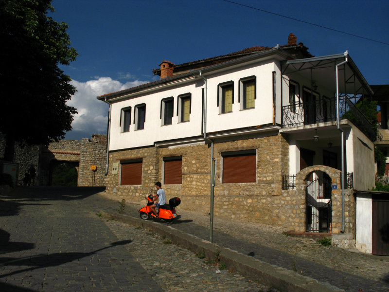 Local youth on a scooter near the Upper Gate