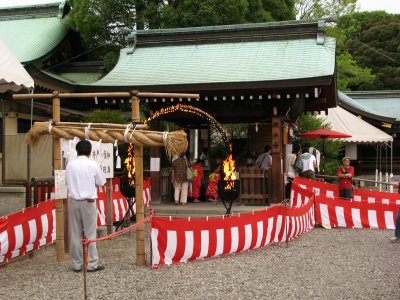 Flame-ringed arch in front of a smaller shrine