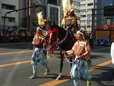 Samurai on horseback with attendants