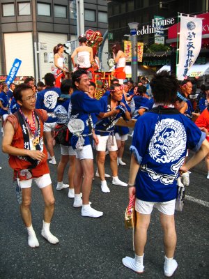 Mikoshi attendants resting in a lull