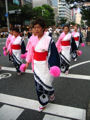 Bon dancers starting down the street