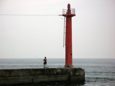 Lone fisherman on the pier