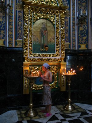 Lighting candles in the cathedral