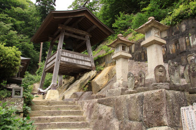 Stone lanterns and bell tower at Oku-no-in