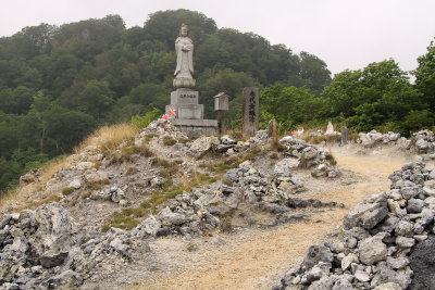 Stone cairns leading to a bodhisattva statue