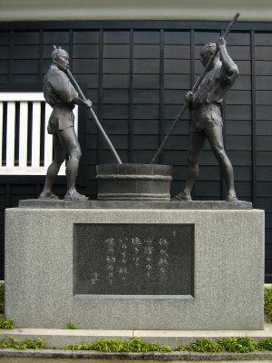Statuary beside a sake brewery
